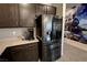 Kitchen featuring stainless steel fridge and modern cabinets at 5528 Eleganza Ave, Pahrump, NV 89061