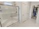 Modern shower with a glass door, white tiled walls, and built-in seating at 5528 Eleganza Ave, Pahrump, NV 89061