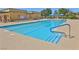 Spacious community swimming pool with lane markers and lounge areas for residents' enjoyment at 5528 Eleganza Ave, Pahrump, NV 89061