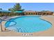 Inviting community swimming pool with blue accents and lounge chairs for relaxing by the water at 5528 Eleganza Ave, Pahrump, NV 89061