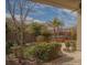 Lush backyard featuring a built-in hot tub, mature trees, and a meticulously maintained landscape design at 5989 Sierra Medina Ave, Las Vegas, NV 89139