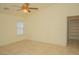 Bedroom featuring tile flooring, a ceiling fan, and a window at 5989 Sierra Medina Ave, Las Vegas, NV 89139