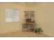 Neutral bedroom featuring tiled floors and a desk area near the window at 5989 Sierra Medina Ave, Las Vegas, NV 89139