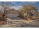 Inviting single-story home with desert landscaping and an attached two-car garage at 5989 Sierra Medina Ave, Las Vegas, NV 89139