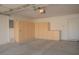 Spacious garage with built-in cabinets, offering ample storage space and organization options at 5989 Sierra Medina Ave, Las Vegas, NV 89139