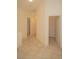 Hallway with tile flooring and arched doorways with doors leading to rooms at 5989 Sierra Medina Ave, Las Vegas, NV 89139