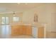 Kitchen area with a peninsula countertop, tile floors, sink and a dishwasher at 5989 Sierra Medina Ave, Las Vegas, NV 89139