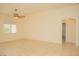 View of the living room with tile flooring, a ceiling fan, and an arched doorway at 5989 Sierra Medina Ave, Las Vegas, NV 89139