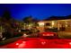 Outdoor oasis features a covered patio, hot tub and lush landscaping at 6156 Twilight Cove Cir, Las Vegas, NV 89131