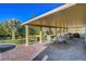 Covered patio offers ample space for dining and relaxation with views of the landscaped backyard at 6156 Twilight Cove Cir, Las Vegas, NV 89131