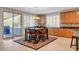 Cozy dining area with natural light, custom cabinets, and easy access to the outdoor deck at 6156 Twilight Cove Cir, Las Vegas, NV 89131