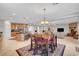 Open concept kitchen and dining area with stainless steel appliances and tile flooring at 6156 Twilight Cove Cir, Las Vegas, NV 89131