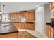 Kitchen featuring custom cabinetry, stainless steel appliances, and stylish backsplash at 6156 Twilight Cove Cir, Las Vegas, NV 89131