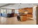 Open kitchen and dining area featuring a breakfast bar island and sliding door to a covered patio at 6156 Twilight Cove Cir, Las Vegas, NV 89131