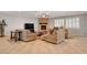 Living area with fireplace, neutral furniture, and tile floors providing a comfortable gathering space at 6156 Twilight Cove Cir, Las Vegas, NV 89131