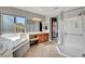 Bright main bathroom with dual sinks, a soaking tub, and a separate glass shower at 6156 Twilight Cove Cir, Las Vegas, NV 89131