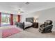 Spacious main bedroom featuring a ceiling fan, and access to the backyard at 6156 Twilight Cove Cir, Las Vegas, NV 89131