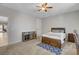 This large carpeted bedroom features a ceiling fan, plenty of space, and neutral décor at 6156 Twilight Cove Cir, Las Vegas, NV 89131