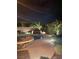 Outdoor pool and jacuzzi with beautiful landscaping and accent lighting for nighttime enjoyment at 6156 Twilight Cove Cir, Las Vegas, NV 89131