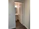 Half-bathroom featuring pedestal sink and round mirror with overhead lighting at 6425 W Haleh Ave, Las Vegas, NV 89141