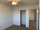 Bedroom featuring a ceiling fan, carpeted floors, and a closet at 6425 W Haleh Ave, Las Vegas, NV 89141