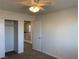 Bedroom featuring a ceiling fan, carpeted floors, and a closet at 6425 W Haleh Ave, Las Vegas, NV 89141