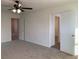 Bedroom featuring a modern ceiling fan and two closets at 6425 W Haleh Ave, Las Vegas, NV 89141