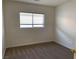 Bedroom with carpet and a large window with blinds at 6425 W Haleh Ave, Las Vegas, NV 89141