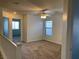 Upstairs bonus room with carpet, a ceiling fan, and natural light at 6425 W Haleh Ave, Las Vegas, NV 89141