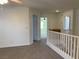 Hallway featuring neutral carpet and multiple doors leading to different rooms at 6425 W Haleh Ave, Las Vegas, NV 89141