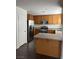 Kitchen featuring stainless steel appliances, an island, and wood cabinets at 6425 W Haleh Ave, Las Vegas, NV 89141