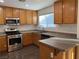 Bright kitchen featuring stainless steel appliances, wood cabinets, and island at 6425 W Haleh Ave, Las Vegas, NV 89141