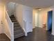 Living room featuring stairs and hardwood floors at 6425 W Haleh Ave, Las Vegas, NV 89141