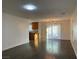 Open-concept living room featuring hardwood floors and sliding glass door at 6425 W Haleh Ave, Las Vegas, NV 89141