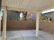 Covered patio area with a concrete slab and brick wall at 6425 W Haleh Ave, Las Vegas, NV 89141