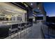 Modern bar area extending to a patio, offering seamless indoor-outdoor living and city views at 667 Solitude Rock Ct, Henderson, NV 89012