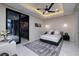 Contemporary bedroom with a gray rug, recessed lighting, and sliding doors at 667 Solitude Rock Ct, Henderson, NV 89012