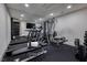 Well-equipped gym with treadmills, weight machines, and mirrored walls at 667 Solitude Rock Ct, Henderson, NV 89012