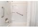 Clean, white bathroom with tub and accessibility features at 6731 Fallona Ave, Las Vegas, NV 89156