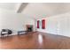 Cozy living room features a brick fireplace and wood flooring at 6731 Fallona Ave, Las Vegas, NV 89156