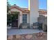 Charming home exterior with desert landscaping and benches on the front porch at 6903 Wineberry Dr, Las Vegas, NV 89119