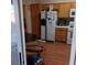 Cozy kitchen with wooden cabinets and a side-by-side refrigerator at 6903 Wineberry Dr, Las Vegas, NV 89119