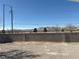 Mountain view from the backyard with block wall fencing and partial desert landscaping at 7133 Tropical Island Cir, Las Vegas, NV 89129