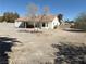 Large backyard with block wall fencing and house in the distance at 7133 Tropical Island Cir, Las Vegas, NV 89129