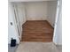 Empty bedroom with a wood laminate floor and white walls showcases a simple and clean space at 7133 Tropical Island Cir, Las Vegas, NV 89129