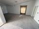 Spacious carpeted living room featuring neutral walls and ample natural light at 7133 Tropical Island Cir, Las Vegas, NV 89129