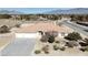 Aerial showcasing single-story home and mountain views, set amidst desert landscaping, in a serene location at 720 Florida St, Pahrump, NV 89048