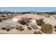 Aerial view showcasing home's desert surroundings and landscaping that blends with the natural environment at 720 Florida St, Pahrump, NV 89048