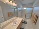 Bathroom featuring double sinks with a shower and bathtub at 720 Florida St, Pahrump, NV 89048