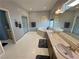 Well-lit bathroom with double sinks, soaking tub, and large mirrors enhancing the spa-like feel at 720 Florida St, Pahrump, NV 89048